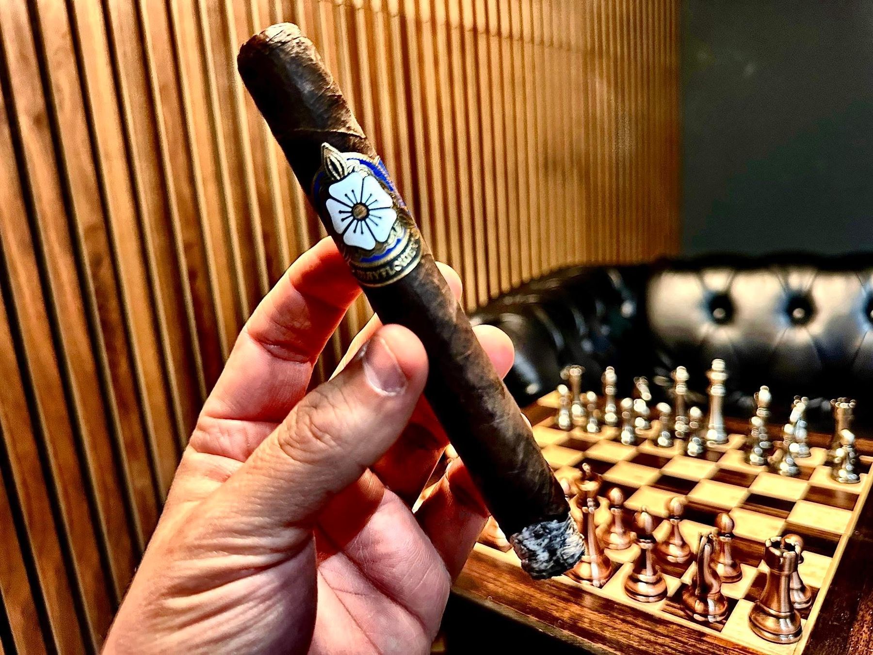 A cigar and a chess game in the lounge